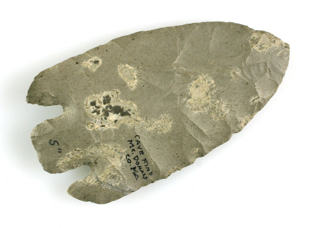 5" Smith Point - Davis COA Broken & Glued: McDonald Co., Missouri example in a gray chert. Davis lists it as having minor modern rechipping to one ear. Also, the other ear has been broken & glued back on. Still, a substantial artifact.