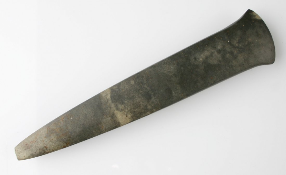 10" Flared Bit Spud: Dark gray diorite example from the Harold Mohrman Collection of St. Louis Missouri. Some nice ochre deposits along with hafting patina. Nicely polished with squared edges and sides.