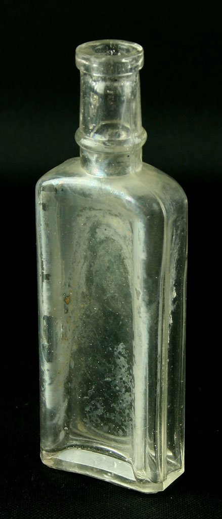 6 1/16" Medicine Bottle: Unmarked except for a '26' on the base. Indented sides. Clear glass with some iridescence. Found by Art Heaton in and aroudn Batavia, Ohio.