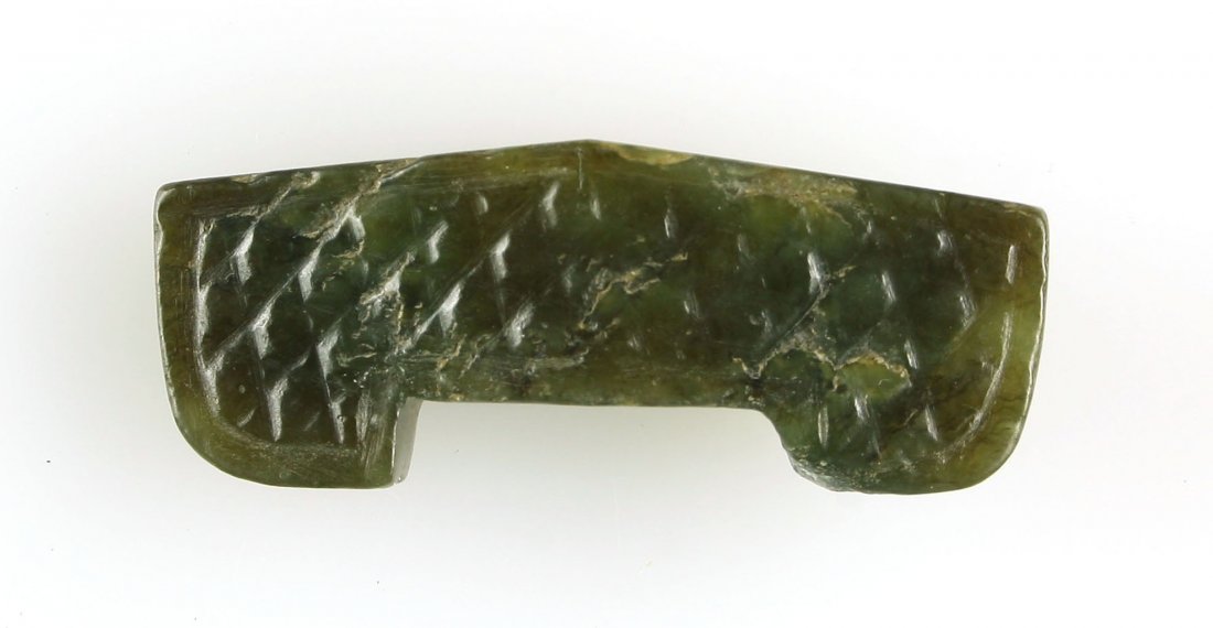 Antique Chinese Jade Dagger Guard: Exquisite example. Deep spinach green Jade with great polish and translucency. Intricately carved grain pattern on both sides. Measures 42mm wide. Weighs 10 grams.