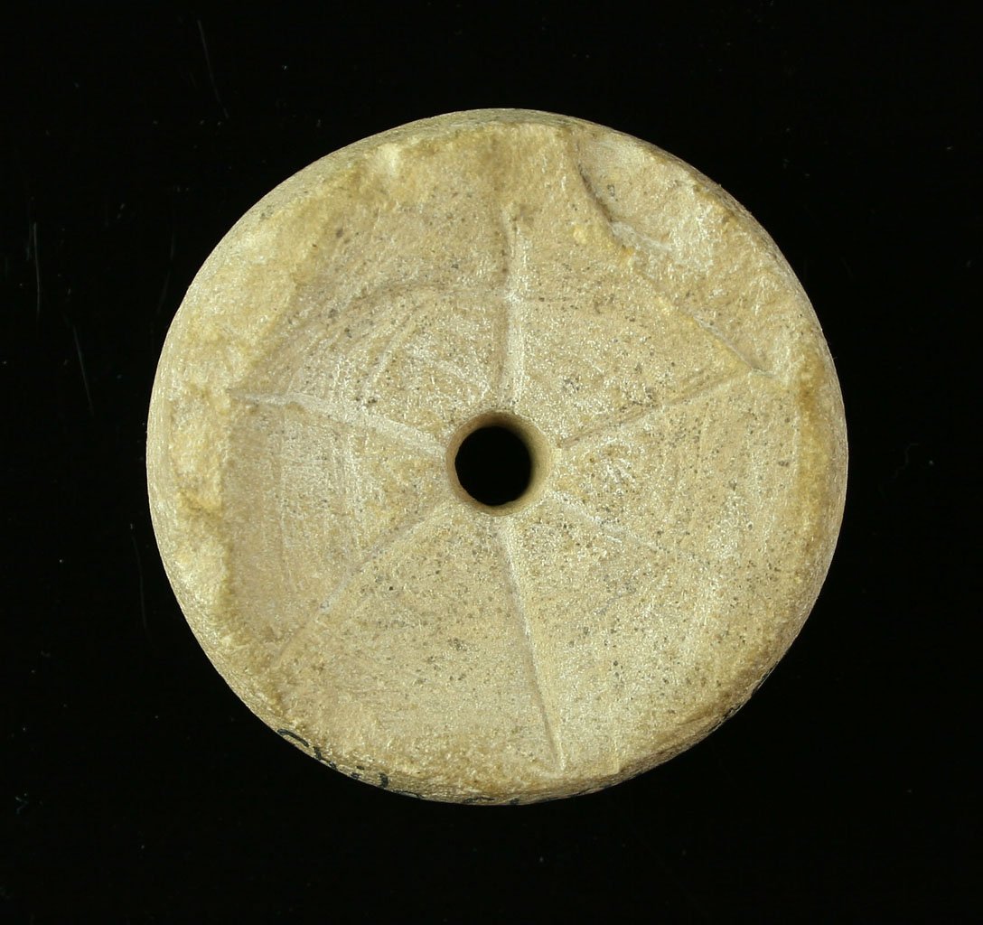 EX MEUSER 1 3/4" Discoidal: Wonderful sandstone example from Clermont Co., Ohio and from the Gordon Meuser (1648/5) and Art Heaton Collections. 4 holes on one side, rays on the other. Incised line around outside edge. Nice!