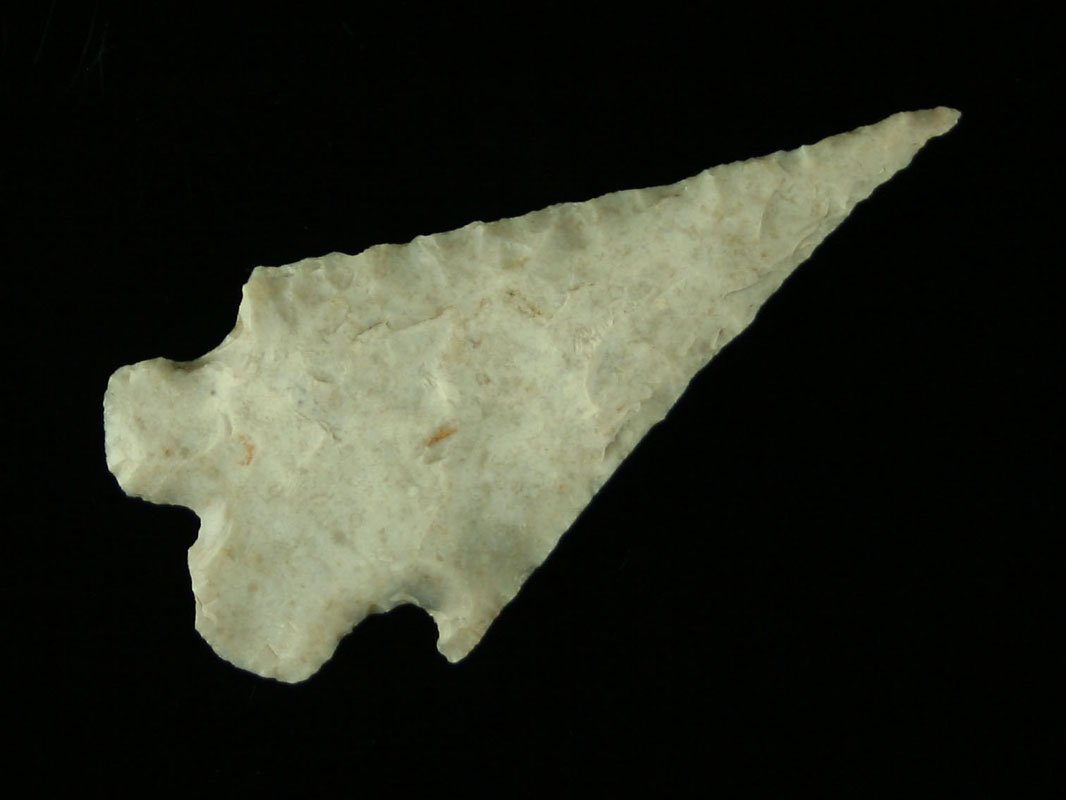 2 1/4" Texas Montell: Sweet example. Ultra thin with classic 'bucked teeth'. Patinated white on one side, other differs. Needle, needle tip. Found by John Koehler in Central Texas in the 1940's & 50's.