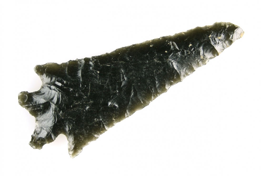 Large 3 1/8" Bifurcated Obsidian Knife: Thin, well made, well patinated example made of translucent Obsidian and loaded with Alkali. Ex- Reg Seely. Collected in Lake Co., Oregon.