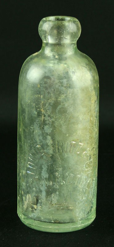 6 5/8" Louis Fritz & Co.: Covington, Kentucky bottle. Blob top. Milk bottle? Raised lettering with raised bottle logo on bottom.