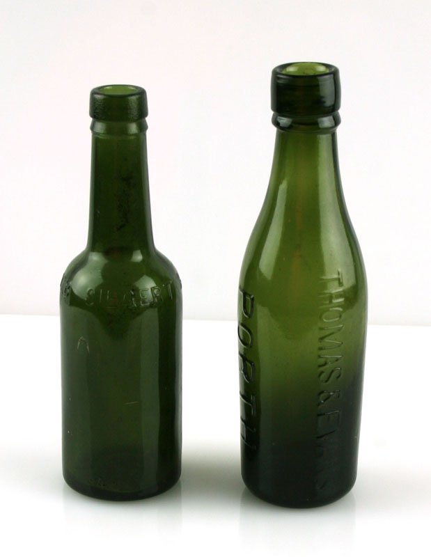 Pair of Nice Green-Glass Bottles: One Thomas & Evans 'PORTH' bottle with internal threading. 1860's-1880's bottle? The other DR JGB Siegert & Sons.