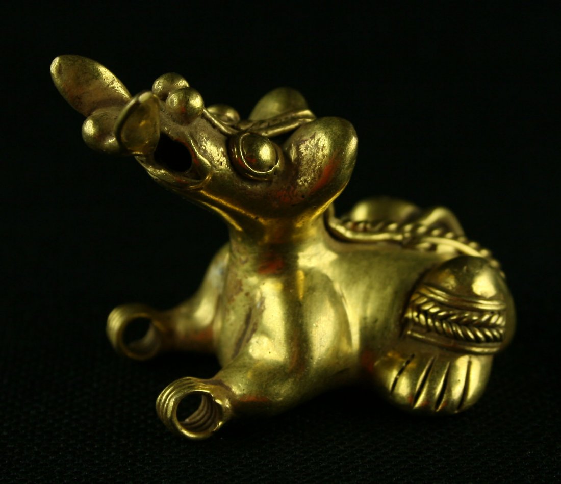 1 7/8" Tairona Gold Effigy Pendant: Representation of a Dog or Jaguar eating a bird. Cast 'Tumbaga' Gold from Colombia. Circa 900-1500AD