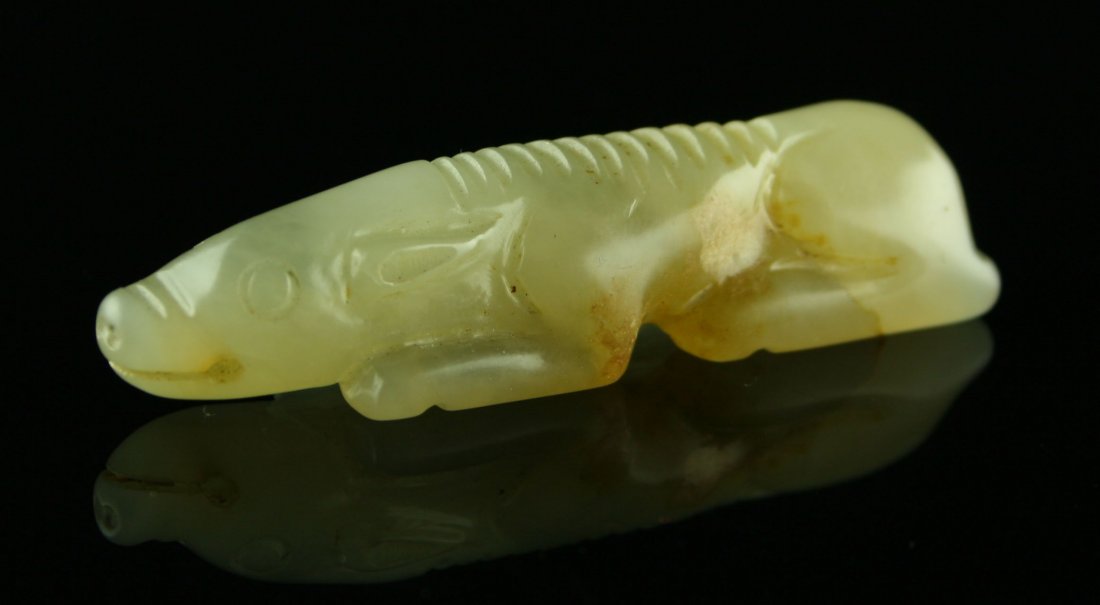 Truly Gorgeous 2 3/4" Han Dynasty Style Jade Pig: Exquisite carving. Totally translucent high quality light green Jade. Unique and very collectible example. Weighs 24 grams.
