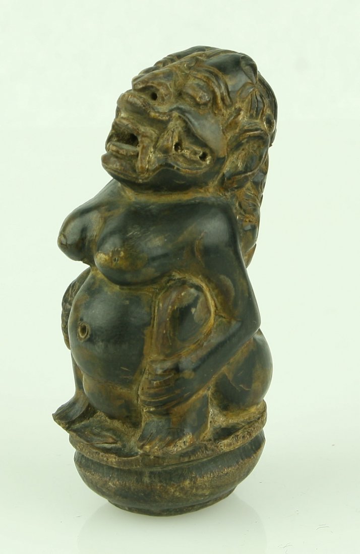 3 3/4" Indonesian Dagger Handle: Intricately carved female demon carved in a dense wood. 19th Century. Neat!