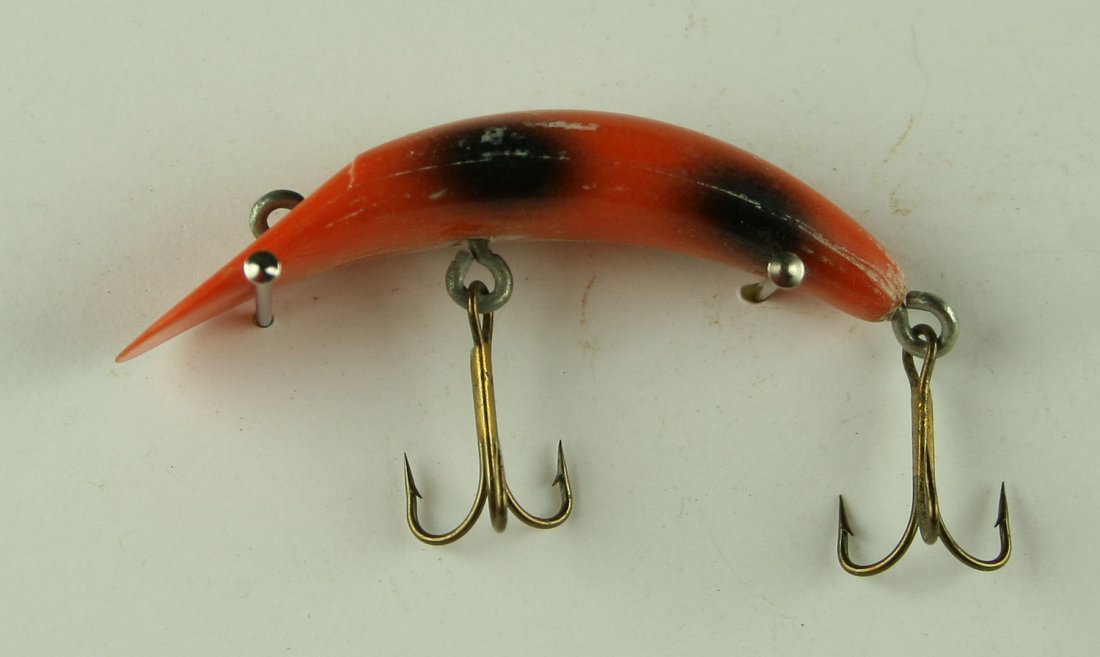 Vintage Flatfish lure: Orange and black resin example. 2 1/4"