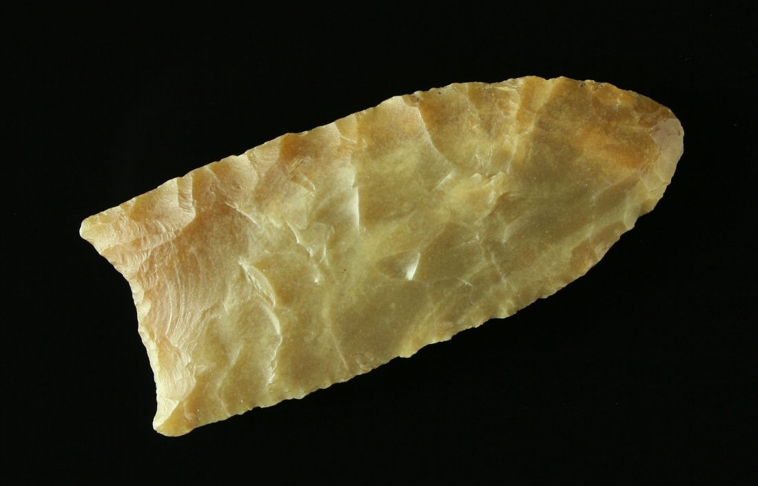 Exceptional 2 5/16" Carter Cave Clovis - Jackson G-9+: Beautiful highly translucent glossy caramel colored Carter Cave. Perfect form with nice flutes on both sides. No stacks, divots, or other anomalies. Found in Carter Co., Kentucky. Jackson G-9+ COA.
