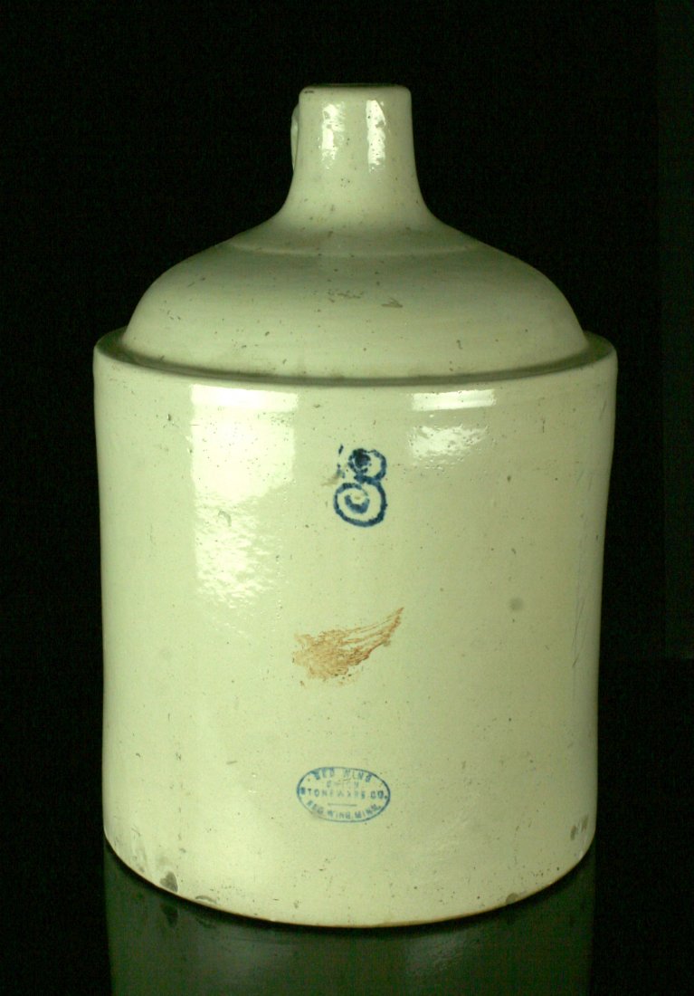 3 Gallon Red Wing Stoneware Liquor Jug: Nice cream colored Stoneware jug made by the Red Wing Stoneware Co., Red Wing, Minnesota. Nice '3' and a redwing stamp in the glaze. Circa 1880s Liquor Jug. Special shipping required.