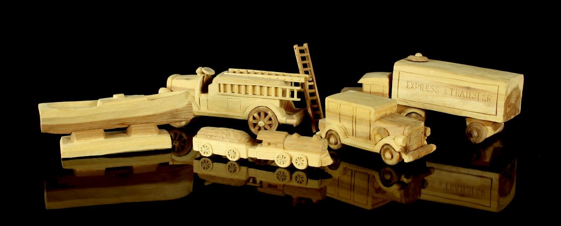 5 Hand Carved Wooden Vehicles: All hand carved by Noted Kentucky Artist, Dale Bratcher. Boat, Car, Train, Truck with Trailer, Fire Engine. Nice!