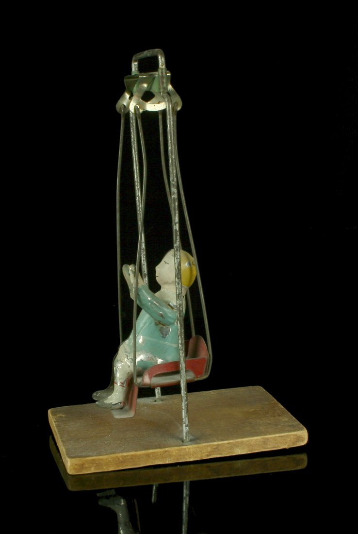 Vintage Original Gibbs Toy Swing: Circa 1920's Painted Tin with Wood Base. Some wear to paint.