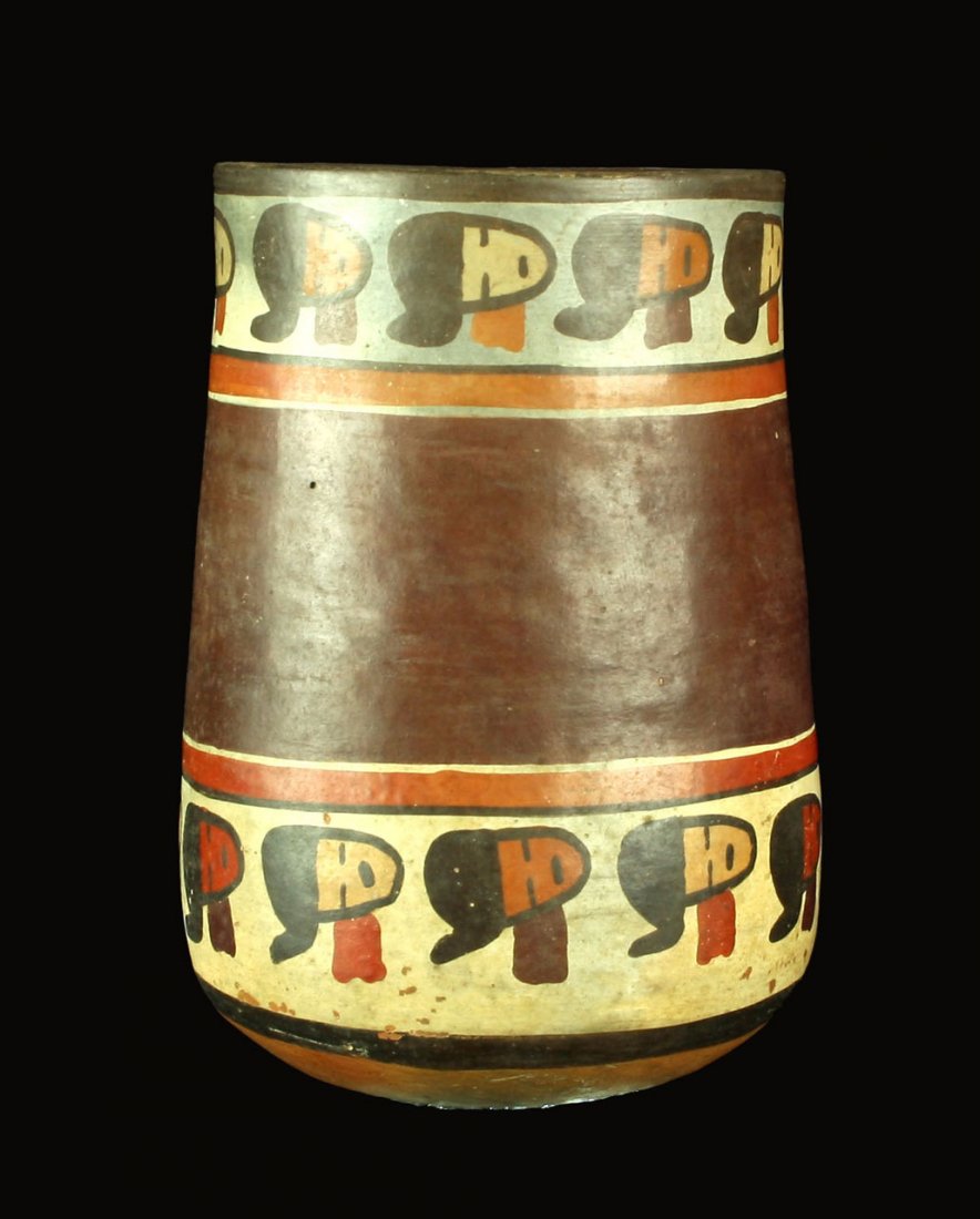 5 1/2" Nazca Polychrome Kero/Beer Cup: Featuring multiple human faces around the top and bottom. Nice. Peru 100BC-300AD. Chavez Estate Collection and collected prior to 1965.