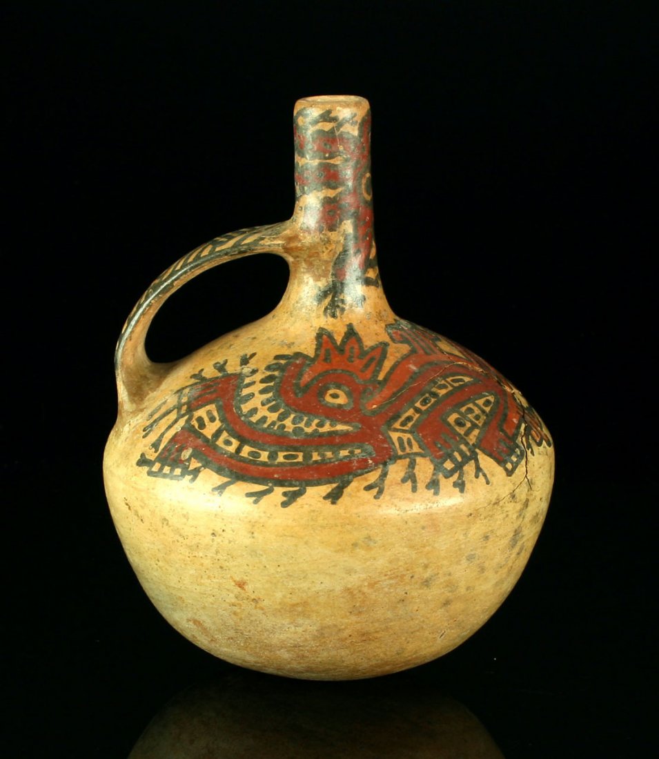 6 3/8" Nazca Polychrom Drinking Vessel: Nice fired clay example from Peru 200-400AD featuring a Abstract Monkey! Vessel is cracked but otherwise stable.