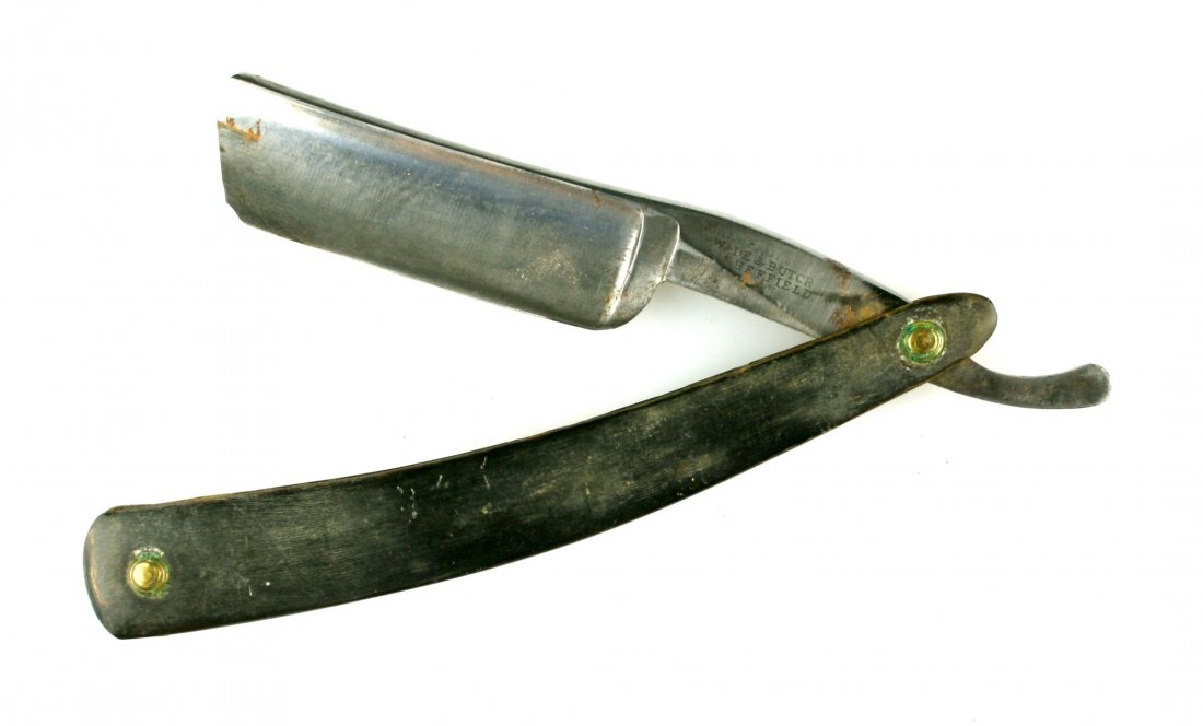 Wade and Butcher Straight Razor: Horn Scales with an approx. 3" blade. Wade and Butcher, Sheffield stamped at hilt. RAZOR sharp still on this 1800's piece.