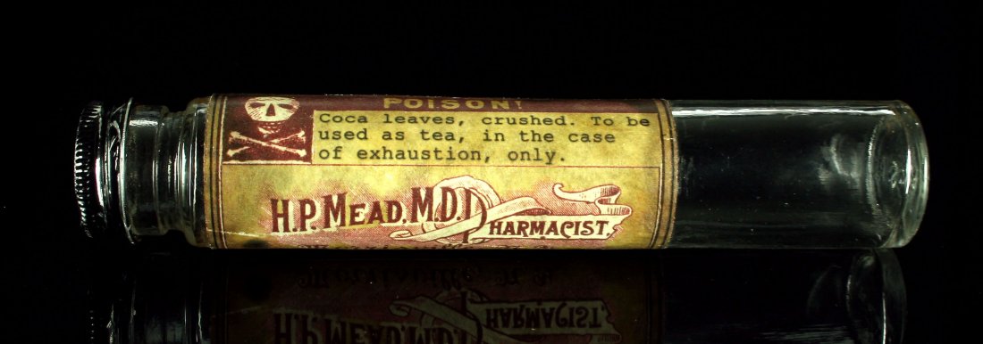 Druggist's 6 3/4" Coca Leaf Bottle: Empty glass bottle/jar labeled from H.P. Mead, M.D. Pharmacist from Morrisville, New York. Interesting.
