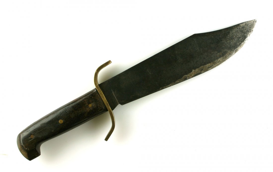 14.5" Western Bowie Knife W49: Nice Large Knife with 9" Fixed blade. Marked 'Western Bowie U.S.A.'. Wooden handle with brass pins and guard. International Buyers may be restricted from purchase due to overall length.