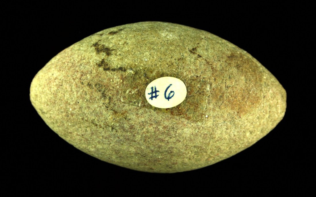 3 1/4" Biconical War Club Head: Would have been encased with leather and hafted to a stick. Pinkish Quartzite. Plains Type. Ex - Cowan Hood Collection.