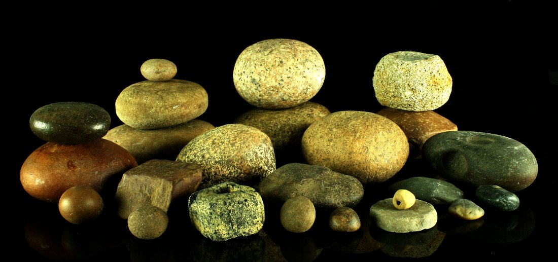 Assorted Stone Artifacts: Nutting Stones, Discoidal Preforms, Game Balls and Hammerstones. Ex - Bratcher Collection.