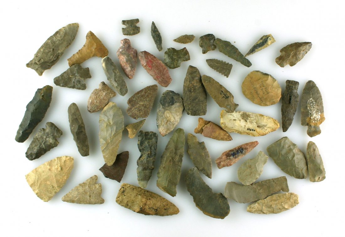 Collection of 40 Kentucky Arrowheads and Artifacts: All collected by Dale Bratcher of Louisville, Kentucky. Biggest is a 3 3/8" Tennesse River Knife. Included Paleo scrapers, blunts, colorful arrowheads, various knives, drill forms, and more.