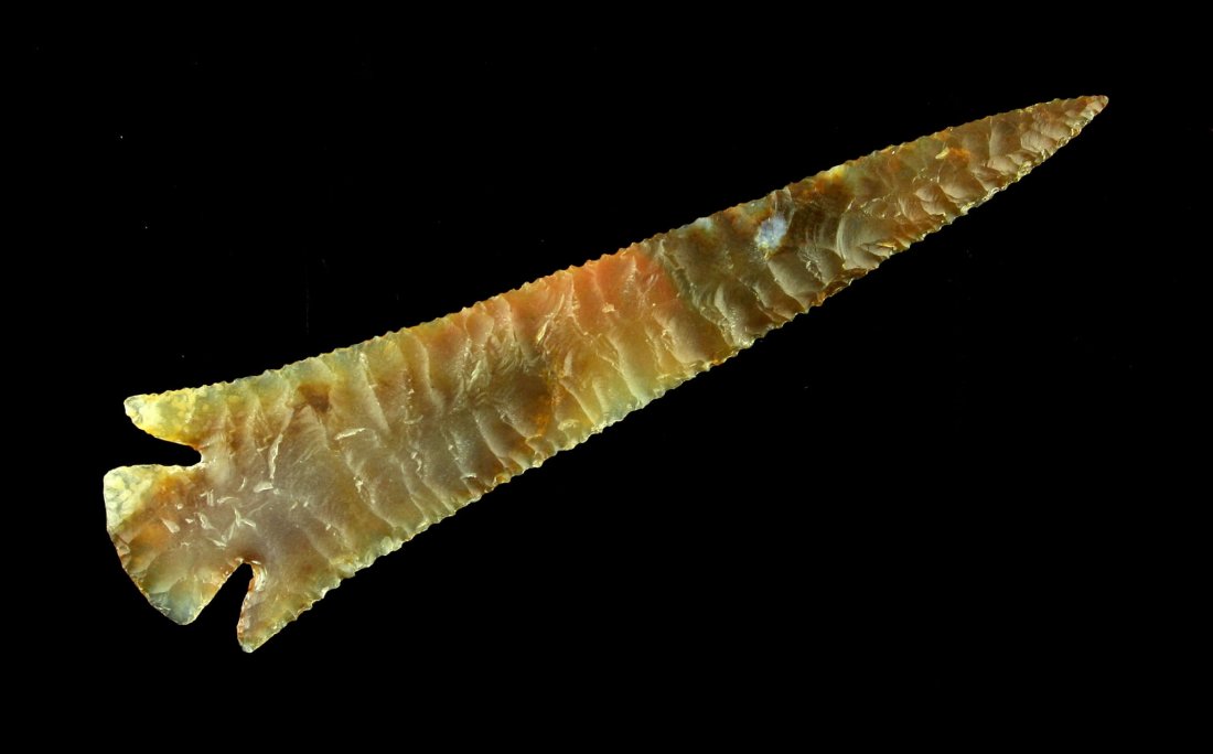 3 3/4" Jim Hopper Reproduction Point: Long and slender exceptional example flaked by noted knapper Jim Hopper from an orange translucent agate. Ex - Charles Shewey Collection.
