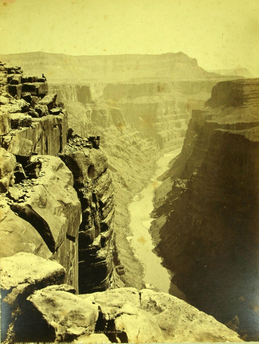 RARE ICONIC John Hillers 1870's-1880's 10x13" Grand: 10x13 albumen on 16x20" matte. John Karl Hillers was part of the 2nd expedition of John Powell thru the American Southwest. This photo depicts the Grand Canyon with man sitting on rim of the canyon. P
