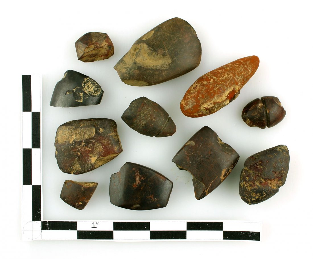 Selection of 11 Hematite Artifacts: All from Carter Co., Kentucky formerly of the Broughton Collection. Includes Tie-on Atl-Atl weights and plummets, celts etc. Mostly fragmentary. Great study or display.