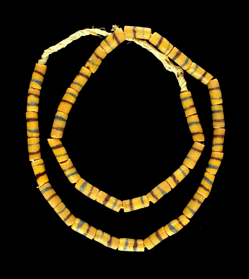 20" Yellow Sand Cast Bead Necklace: Nice yellow with maroon and blue stripes example strung on grass. 20" of beads.