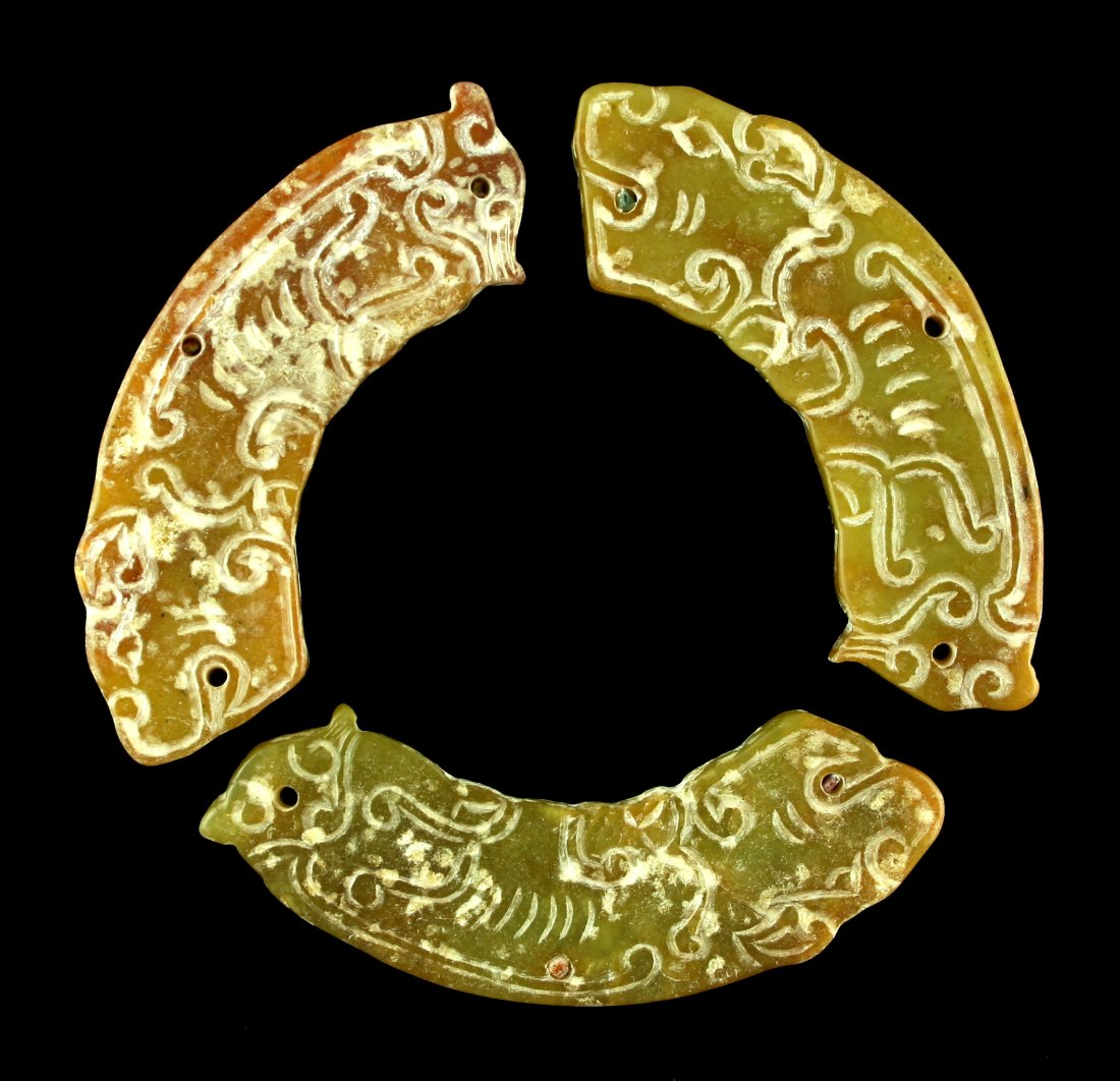 3 nice Chinese Huangs to make a Pi: Drilled for suspension and made of a pretty yellow green jade. Exact age unknown but of the Zhou Dynasty style.