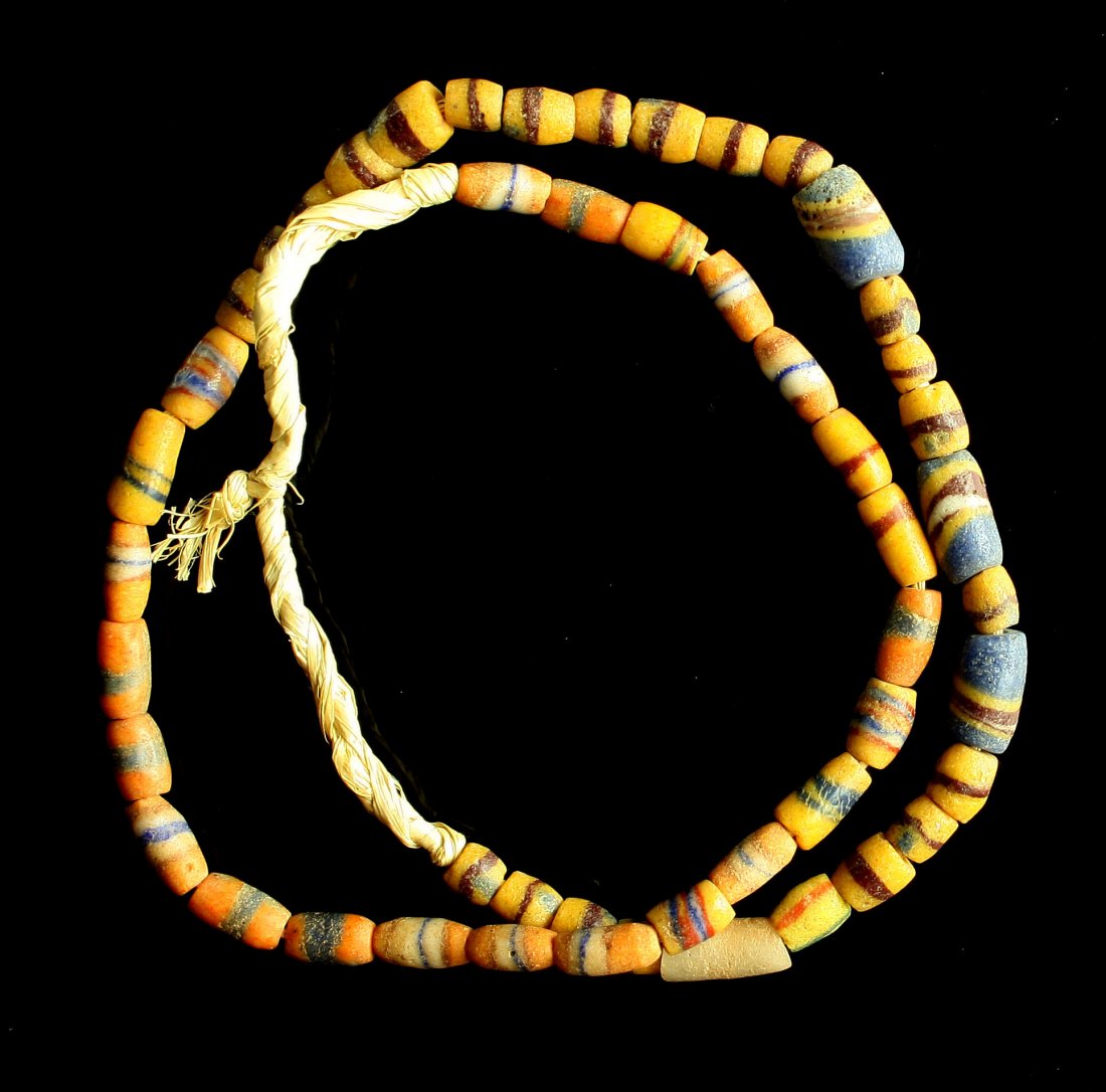 22" Trade Bead Necklace: Sand cast Beads of varying shades of Yellows and Oranges with accent colors.
