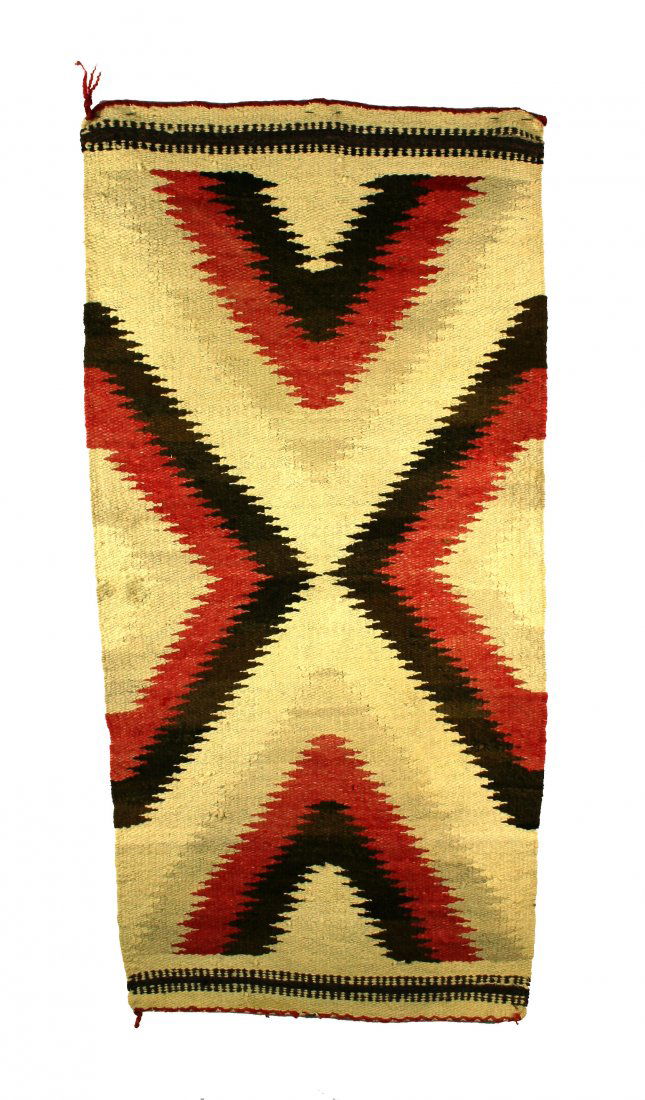 19" X 39" Navajo 'Eye Dazzler' Rug ca. 1930-40's: Overall excellent weaving with lots of color and geometric designs. Very stable, no unravellings or holes. Tassels on all four ends are intact, some a bit longer than the others. Would benefit from a