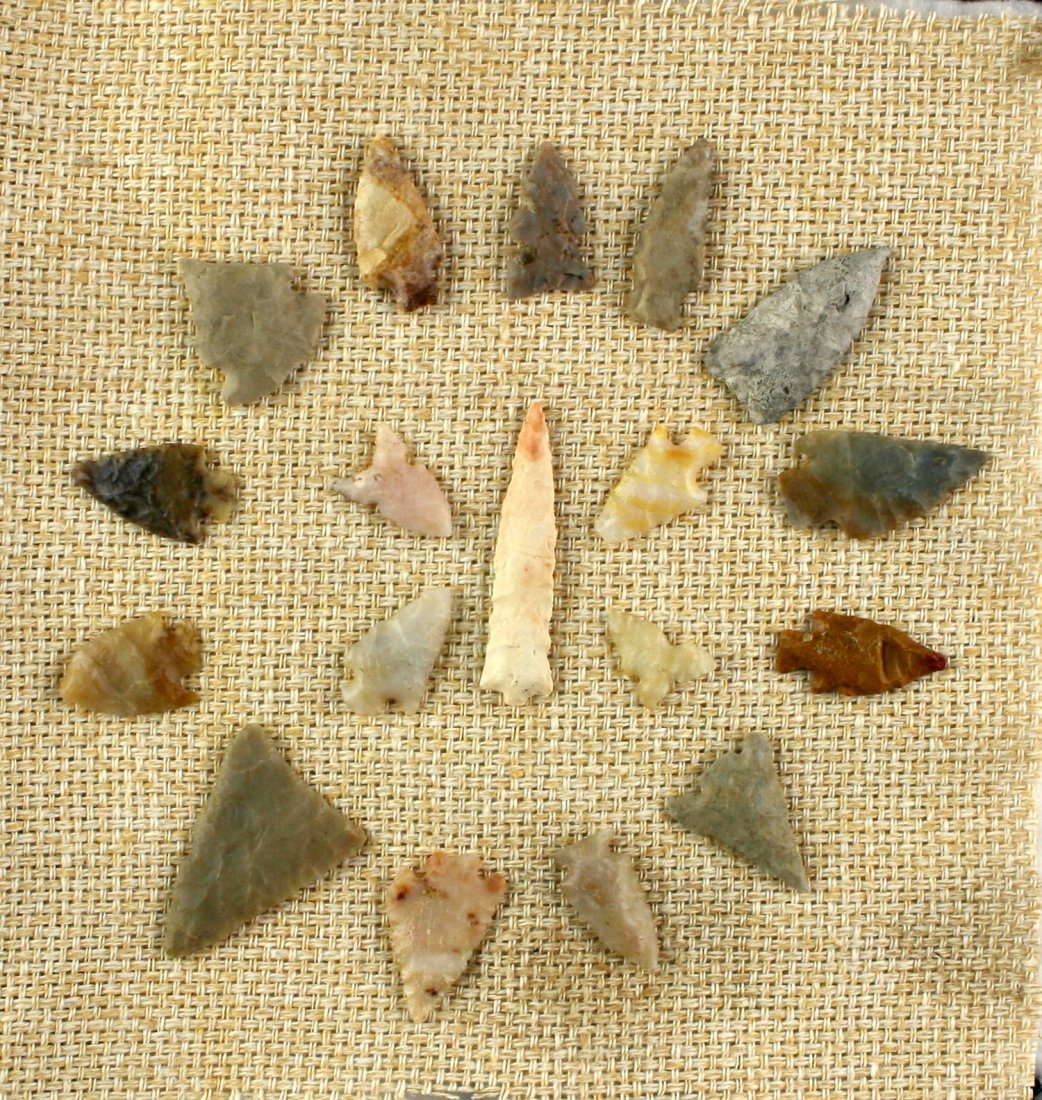 18 piece Display of Nevada Points: Mounted on Burlap approx 6x6". From a Nevada estate. Lots of agates and cherts.