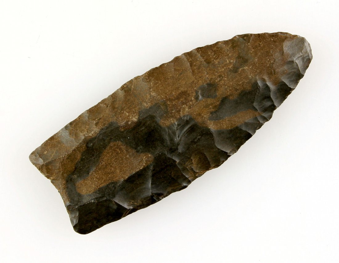 Colorful 2 5/8" KY Clovis - Putty COA: Exceptionally fine two-toned glossy high grade gun metal gray Hornstone example. Very thin and deeply fluted on one side 50%, 30% on the other side. Ex- William Bentley Collection. Todd Co., Kentucky.