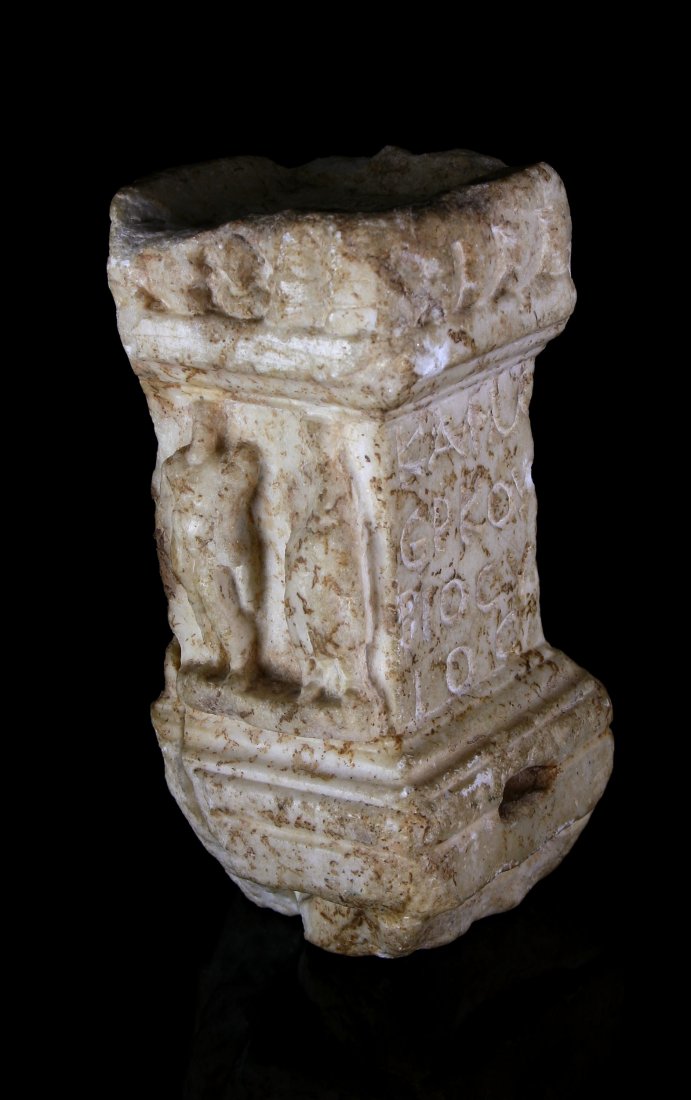 Greek Personal Altar Engraved with Figures: 6 3/4" tall by 3 1/2" square. Depicts in relief two figures, one male, and one undeterminate. Greek Engraved letters to left and right sides. Note also the attachment at the base via mortise