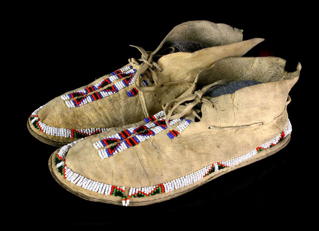 Plains Indian Moccassins: 10" long. Nicely beaded examples with excellent use-wear. Nicely tanned leather. Ex - Dr. Evan Maurer collection.