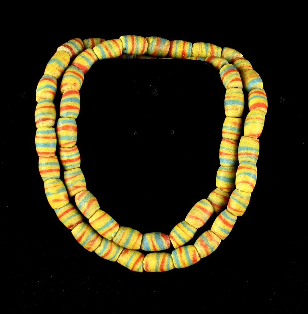 26" Trade Bead Necklace: Sand cast beads in yellow, blue, and red. Each bead is approx. 1/2" x 3/8". From the Dr. Evan Maurer Collection.