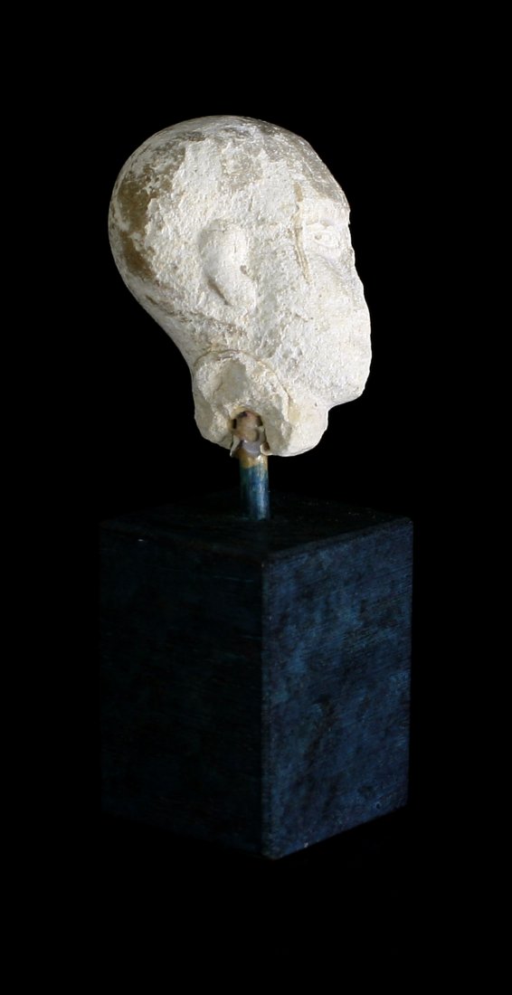 Limestone Egyptian Profile. Mounted: Fragment from a larger sculpture of a pharoah or deity in profile. Limestone. Ex - Los Angeles Collection. Circa 1st Century BC/AD