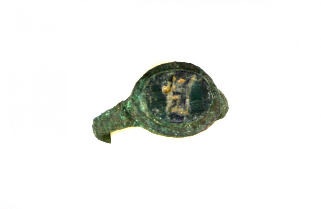 Ancient Roman Bronze Ring with Gold Inlay: Interesting green-patinated example measuring a modern size 8 (24x22mm) with three glass or precious stone inset carved in intaglio of two human figures with remnant gold fill to the intaglio po