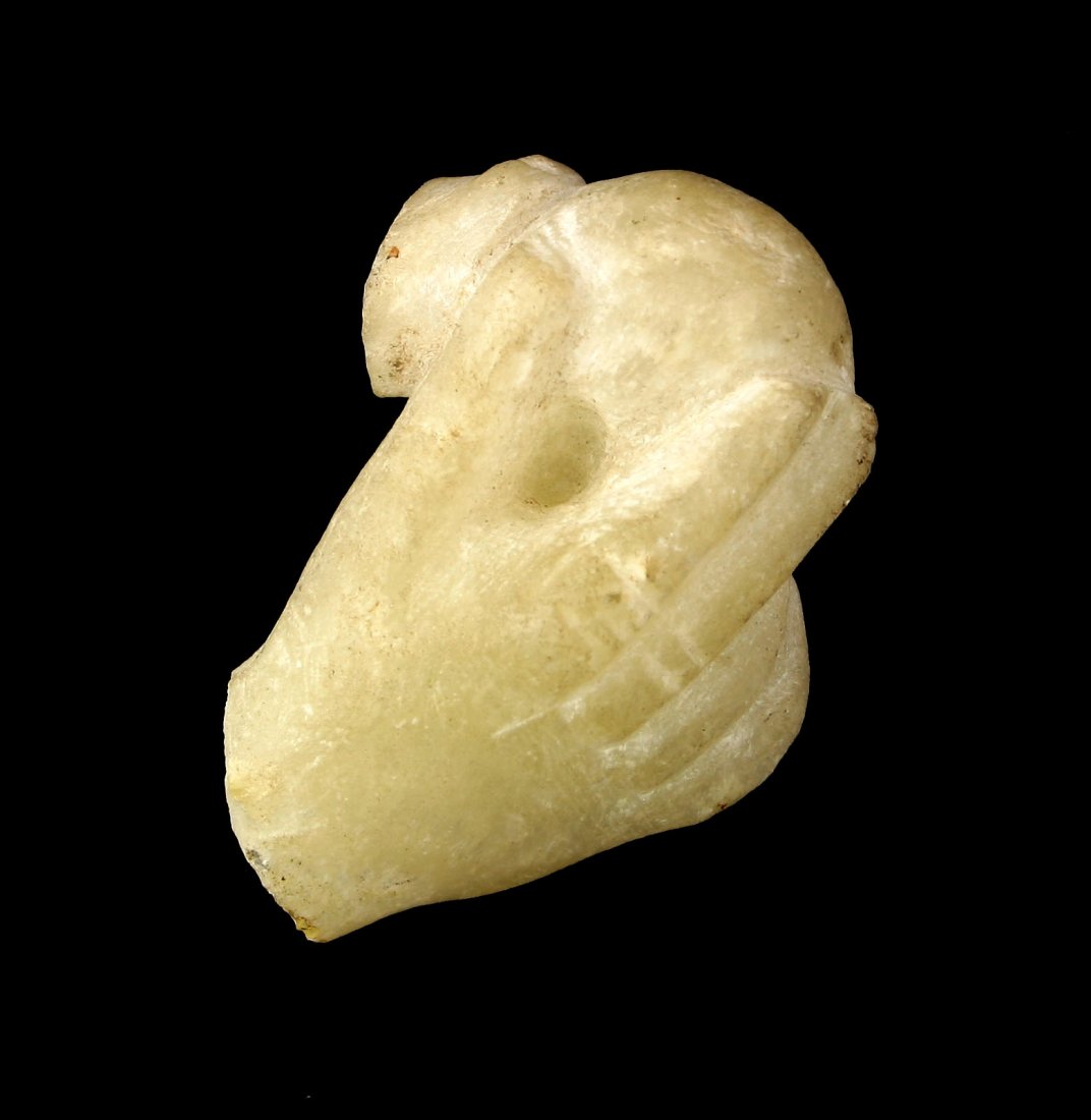 1 5/8" Roman Alabaster Hand Fragment: Holding an unknown spherical object. Formerly of the Tedder estate of Los Angeles. Drilled hole for mounting.