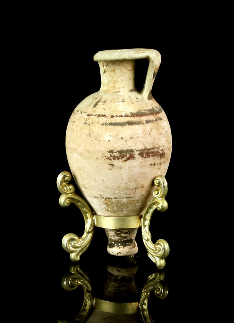 3 1/2" Etrusco-corinthian Amphora with stand: small example with one handle missing. Includes stand. Ex - Tedder estate collection. Los Angeles.
