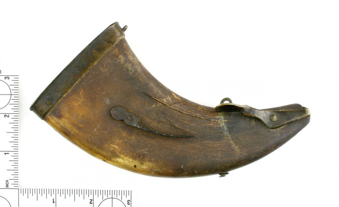 7 1/4" Powderhorn: Unusual flattened form with a brass levered cover. Exact age unknown.