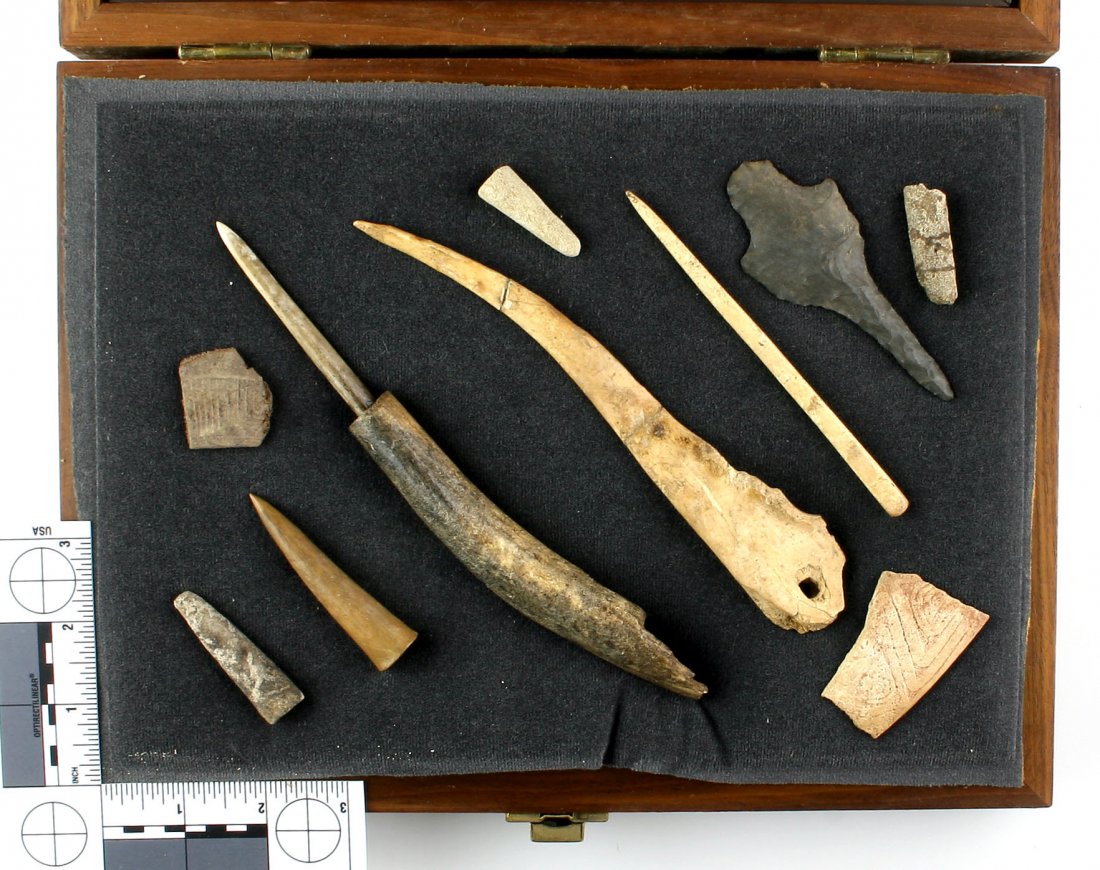 Fantastic Display of Tennessee Bone Artifacts: Antler point, Knapping tools, engraved bone and antler sections, hafted and trigger awls.. Hairpins.. All from Central Tennessee. Ex - Griffin Collection. Includes one flint drill and attractive 9x12 