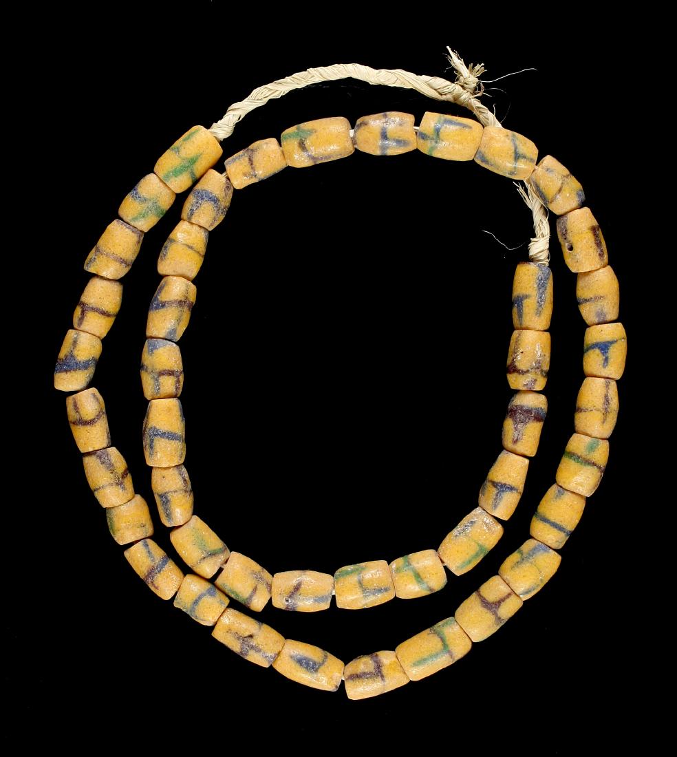 26" Trade Bead Necklace: Sand cast beads in yellow with brown, green and blue accents.