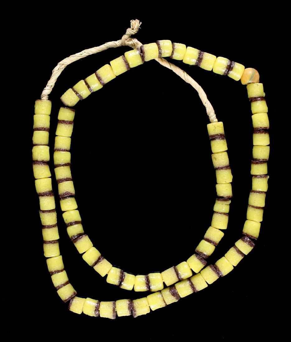 26" Trade Bead Necklace: Yellow with brown sand cast beads.