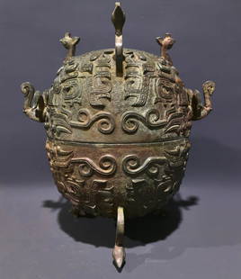 An Archaic Bronze Beast-Face Pattern Tripod Cover Jar: An Archaic Bronze Beast-Face Pattern Tripod Cover Jar,Shang and Zhou Dynasty, China,Size:30.5cmx28cmx21cm,Weight:4.25kg 