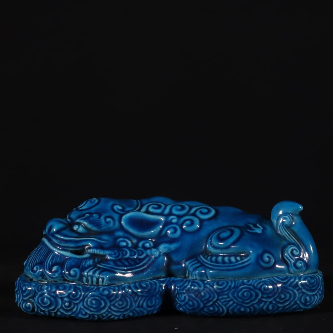 An Exquisite Blue Glazed Auspicious Beast Paper Weight: An Exquisite Blue Glazed Auspicious Beast Paper Weight,Qing Dynasty, China,Qianlong Six-character Mark,Size:4.5cmx14cm 宝石蓝釉瑞兽镇纸,中国