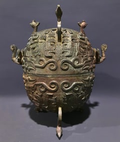 An Archaic Bronze Beast-Face Pattern Beast-Ears Tripod Food Vessel