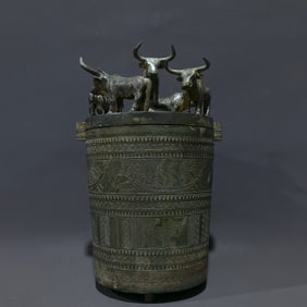 An Archaic Bronze Figure Pattern Double-Ears and Tripod Barrel,With Buffalo Pattern Cover