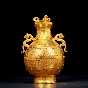 An exquisite gilt bronze vase with double ears and auspicious animal patterns